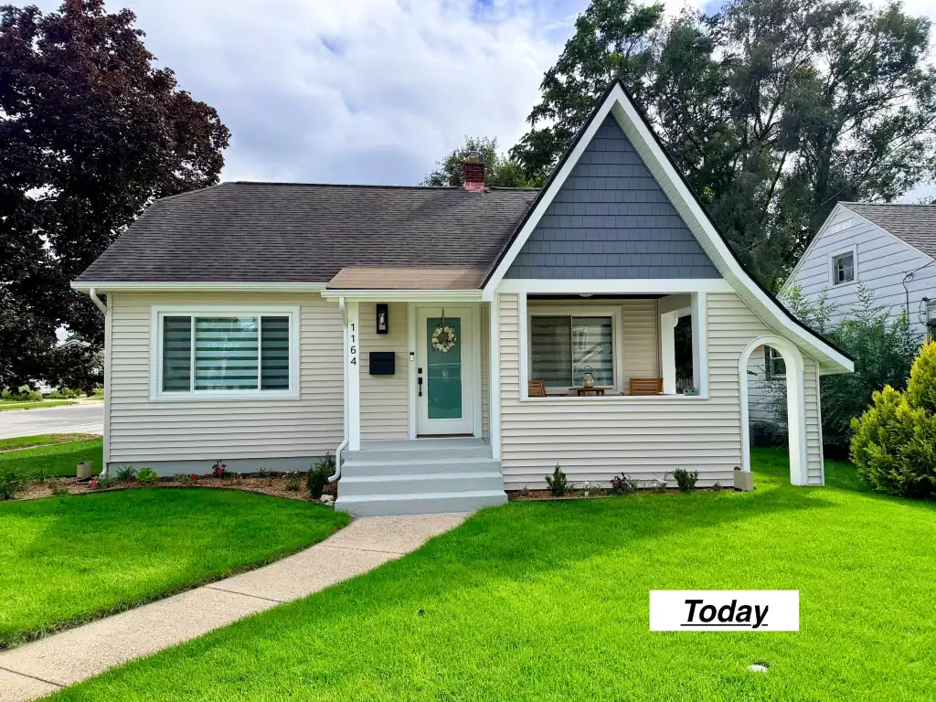 Well-kept white house with porch and green lawn