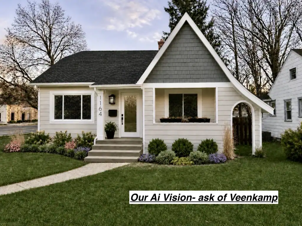 White cottage with steep gable and landscaped front yard