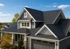 Gray Craftsman home with dark shingle roof